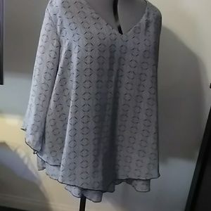 A black and  gray flowy blouse